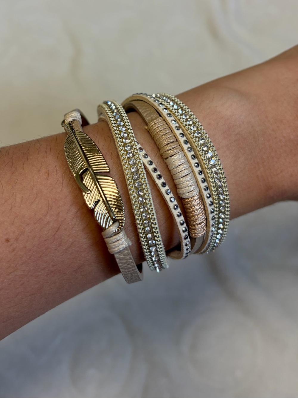 Multi-Strand Gold and Cream Wrap Bracelet with Feather Accent